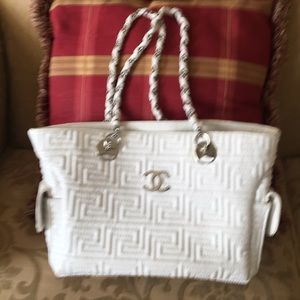 White purse with C C on front